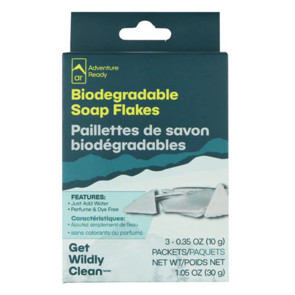Packaging of biodegradable soap flakes with text and product image on a white background