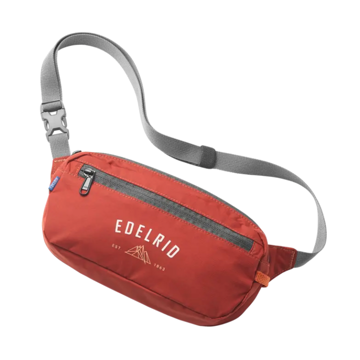 Red waist bag with gray strap on a white background, featuring Edelrid logo.